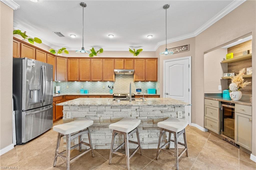 3147 Walnut Grove Lane Alva, FL 33920 - Photo 9 of 45 a kitchen with stainless steel appliances granite countertop a refrigerator a sink and a stove