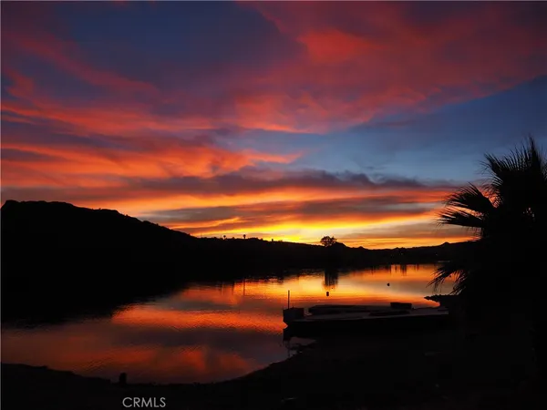 a sunset view with lake view