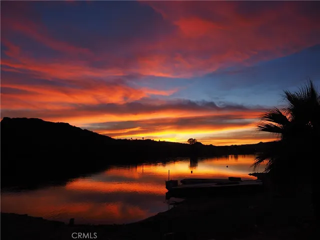a sunset view with lake view