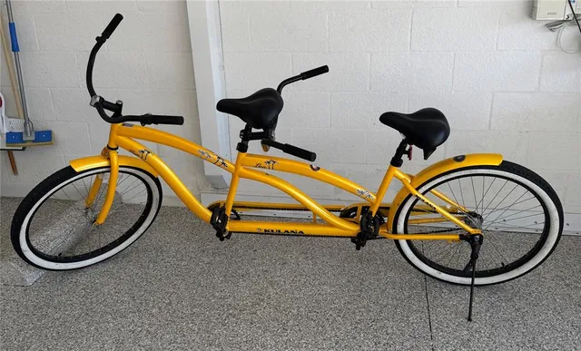 an aerial view of a house with outdoor space and lake view in back