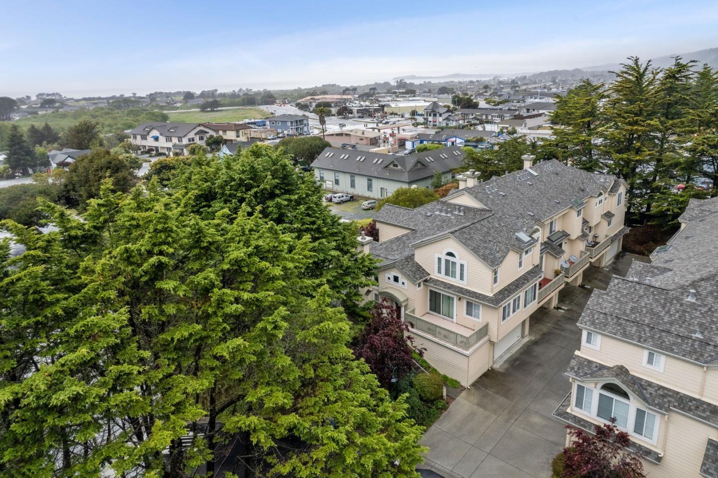 an aerial view of residential houses with outdoor space