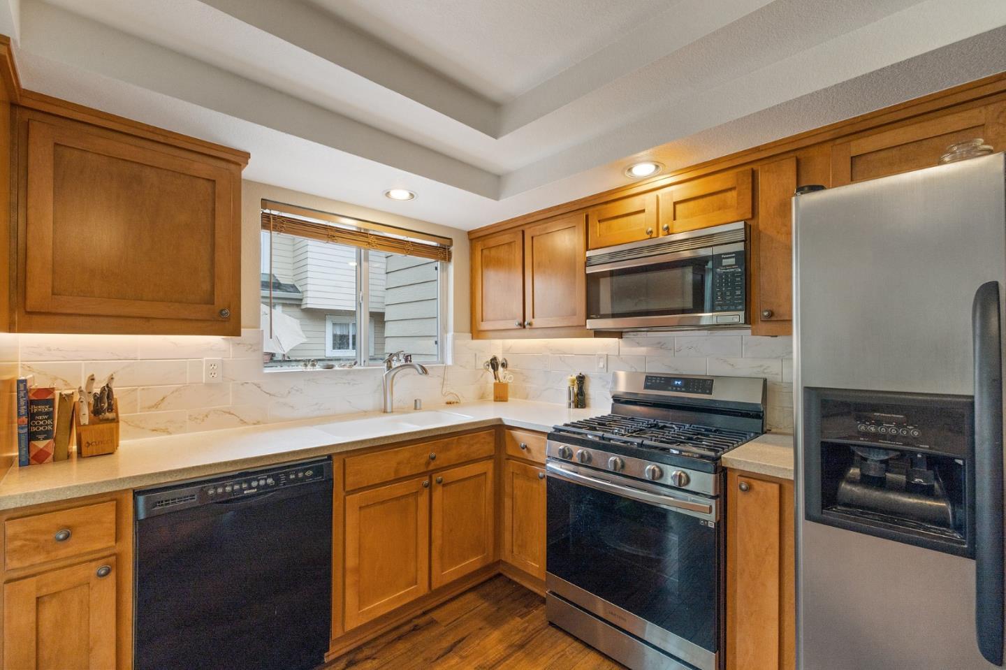 6 Patrick Way Half Moon Bay, CA 94019 - Photo 11 of 28 a kitchen with stainless steel appliances a stove sink and microwave