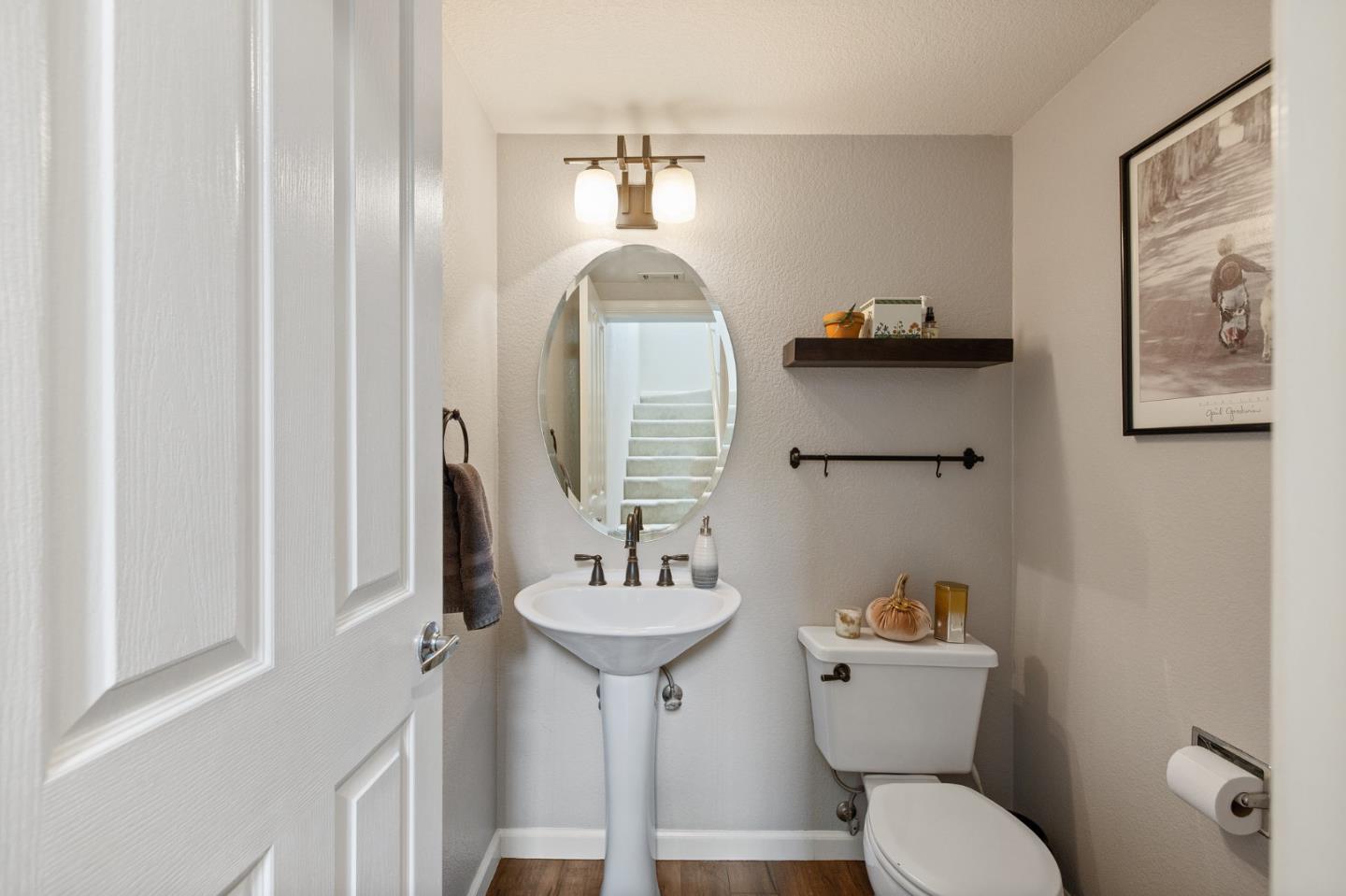6 Patrick Way Half Moon Bay, CA 94019 - Photo 14 of 28 a bathroom with a toilet sink and mirror