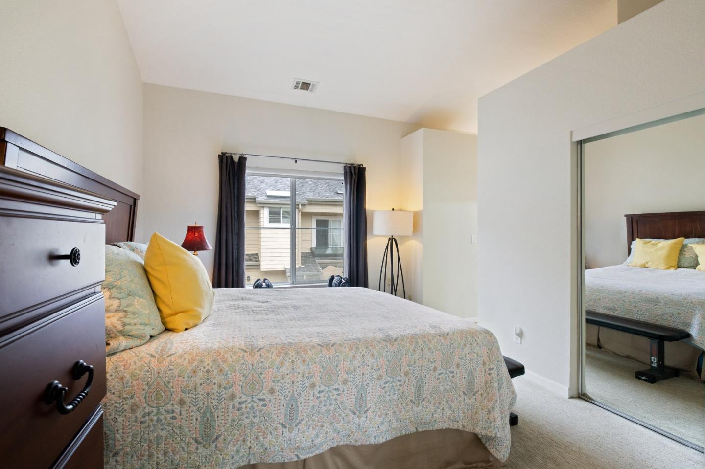 6 Patrick Way Half Moon Bay, CA 94019 - Photo 19 of 28 a bedroom with a bed and a chair