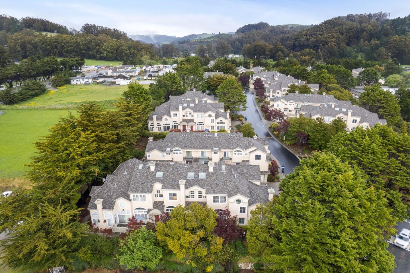 6 Patrick Way Half Moon Bay, CA 94019 - Photo 22 of 28 a view of a city with mountains in the background
