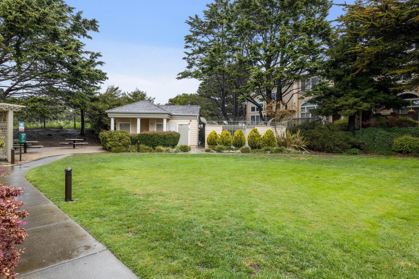 6 Patrick Way Half Moon Bay, CA 94019 - Photo 25 of 28 a front view of a house with garden and trees