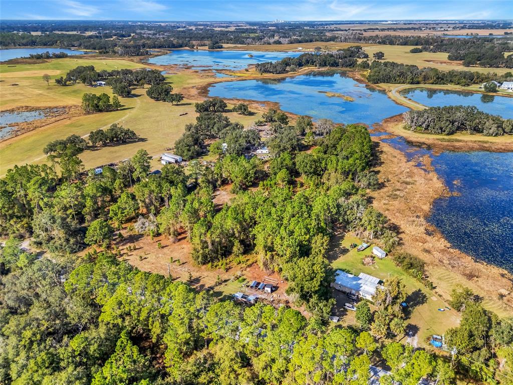 Youth Camp Road Groveland, FL 34736 - Photo 12 of 14 an aerial view of residential houses with outdoor space