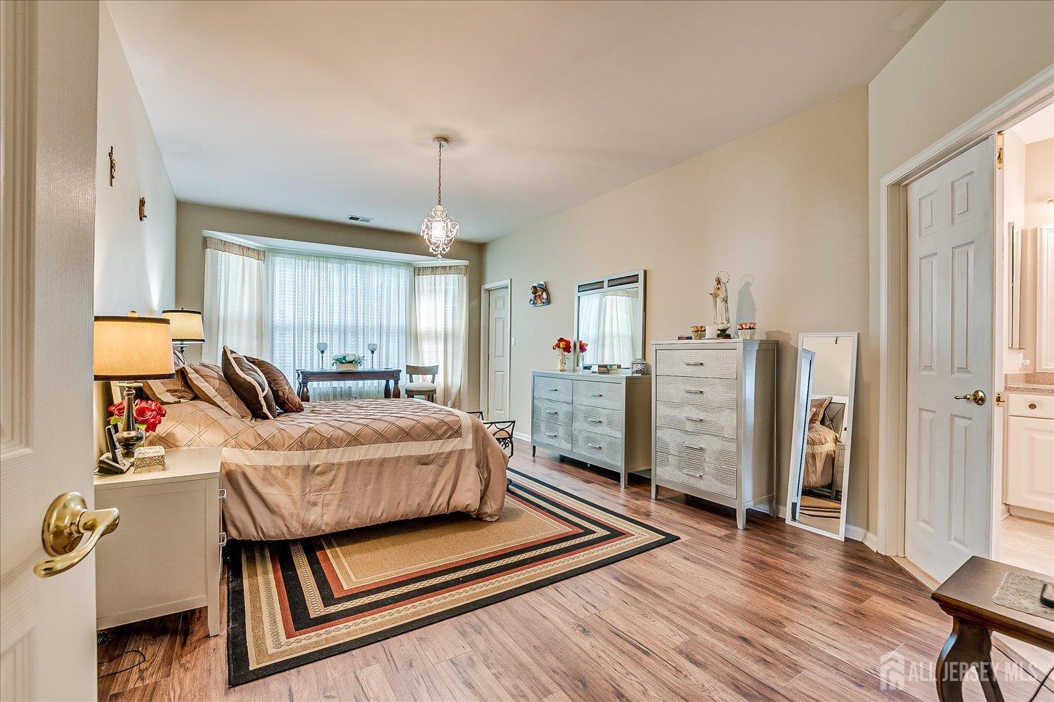 22 Silver Charm Road Manalapan, NJ 07726 - Photo 22 of 51 a living room with furniture and wooden floor