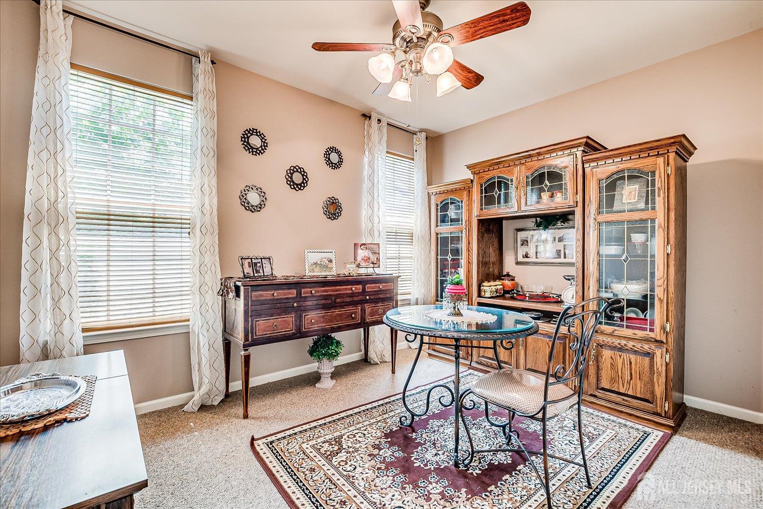 22 Silver Charm Road Manalapan, NJ 07726 - Photo 28 of 51 a reading room with furniture a rug and a window