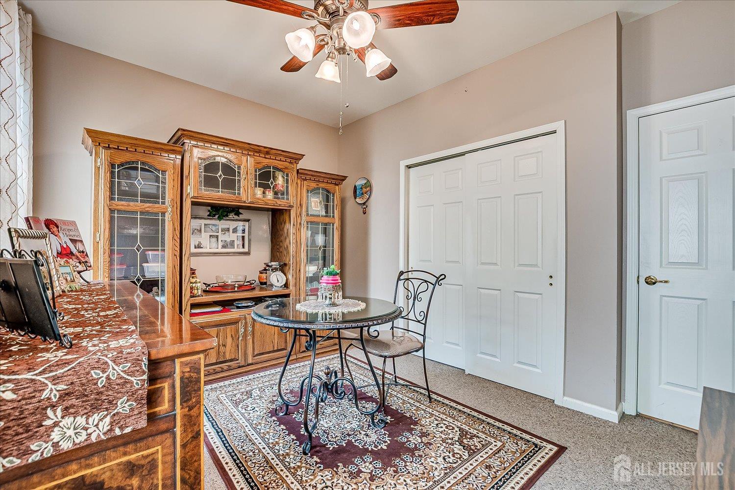 22 Silver Charm Road Manalapan, NJ 07726 - Photo 29 of 51 a work room with furniture and wooden floor