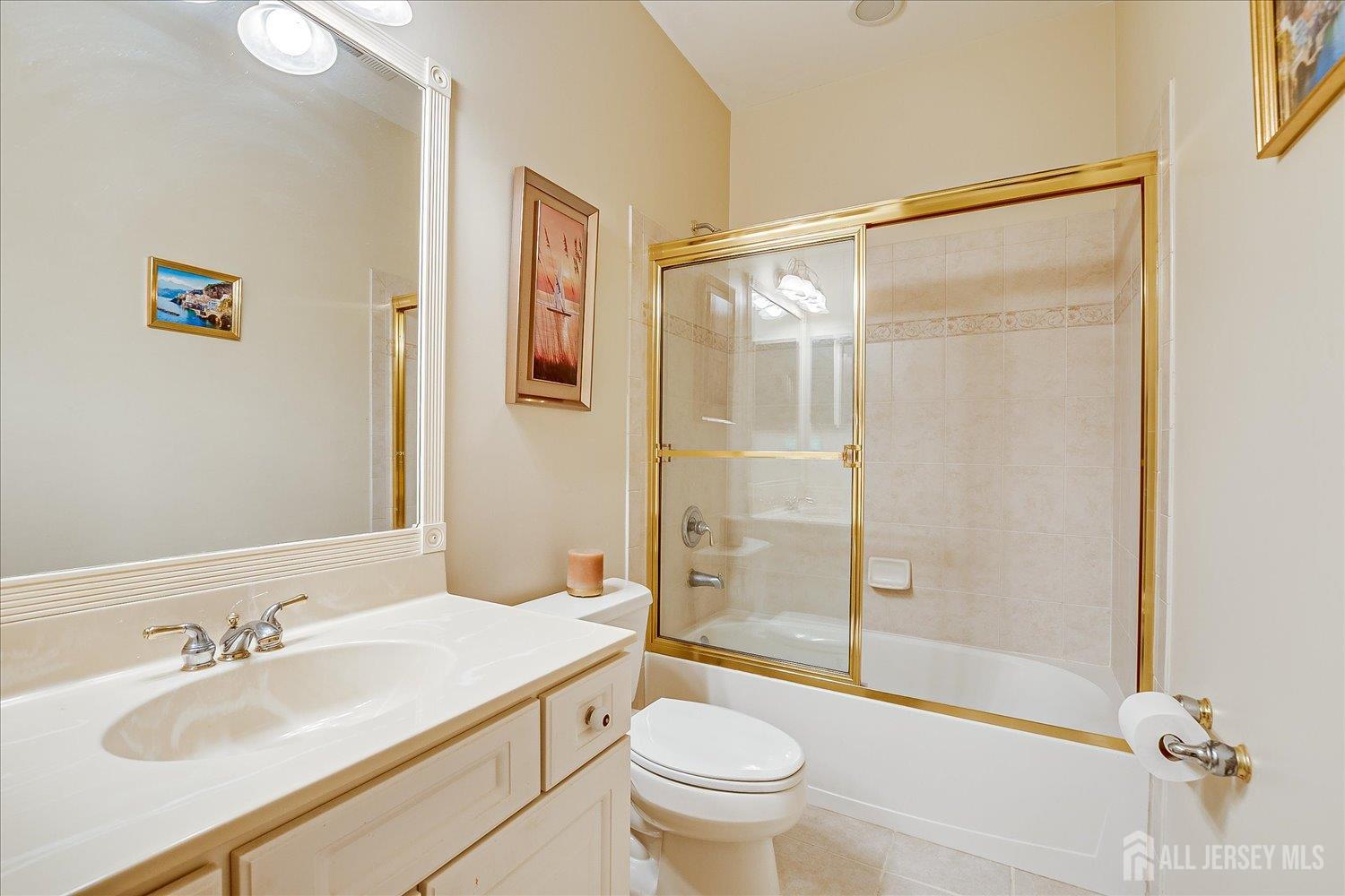22 Silver Charm Road Manalapan, NJ 07726 - Photo 31 of 51 a bathroom with a sink mirror vanity and toilet