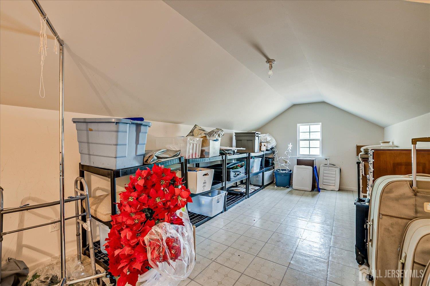 22 Silver Charm Road Manalapan, NJ 07726 - Photo 33 of 51 a living room with furniture a window and gym equipment