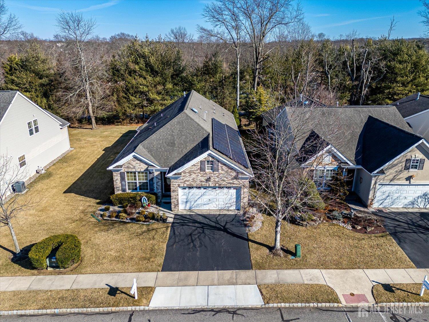 22 Silver Charm Road Manalapan, NJ 07726 - Photo 36 of 51 a view of house and outdoor space