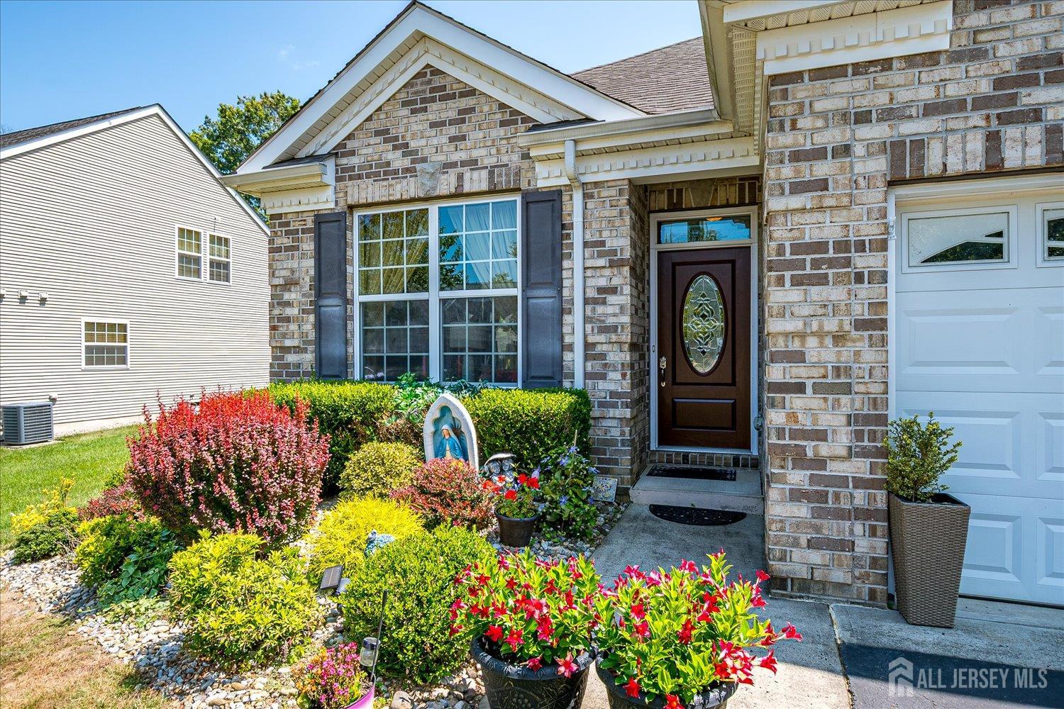 22 Silver Charm Road Manalapan, NJ 07726 - Photo 4 of 51 a front view of a house