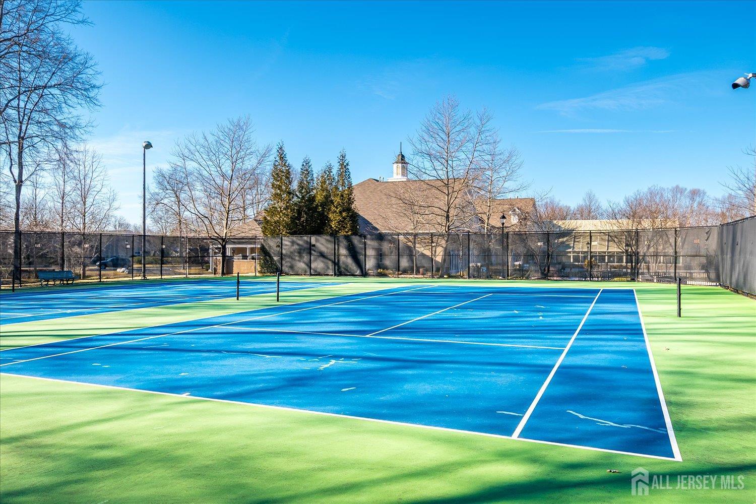 22 Silver Charm Road Manalapan, NJ 07726 - Photo 44 of 51 a view of swimming pool in front of house with yard