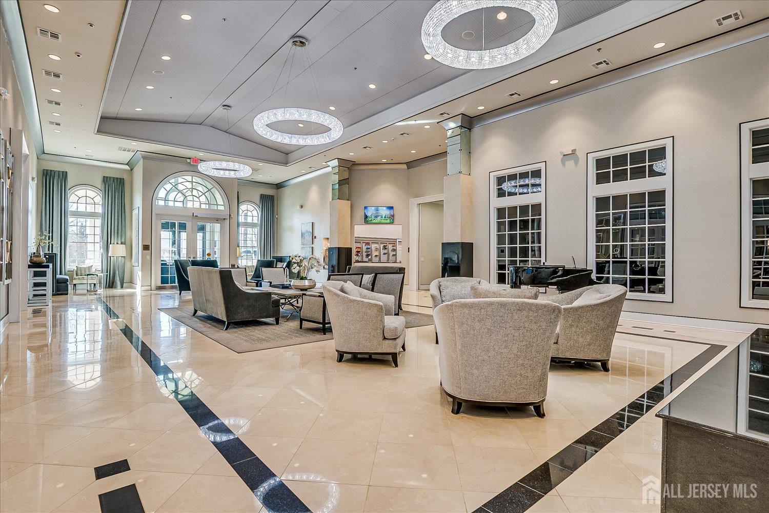 22 Silver Charm Road Manalapan, NJ 07726 - Photo 45 of 51 a living room with furniture and a large window