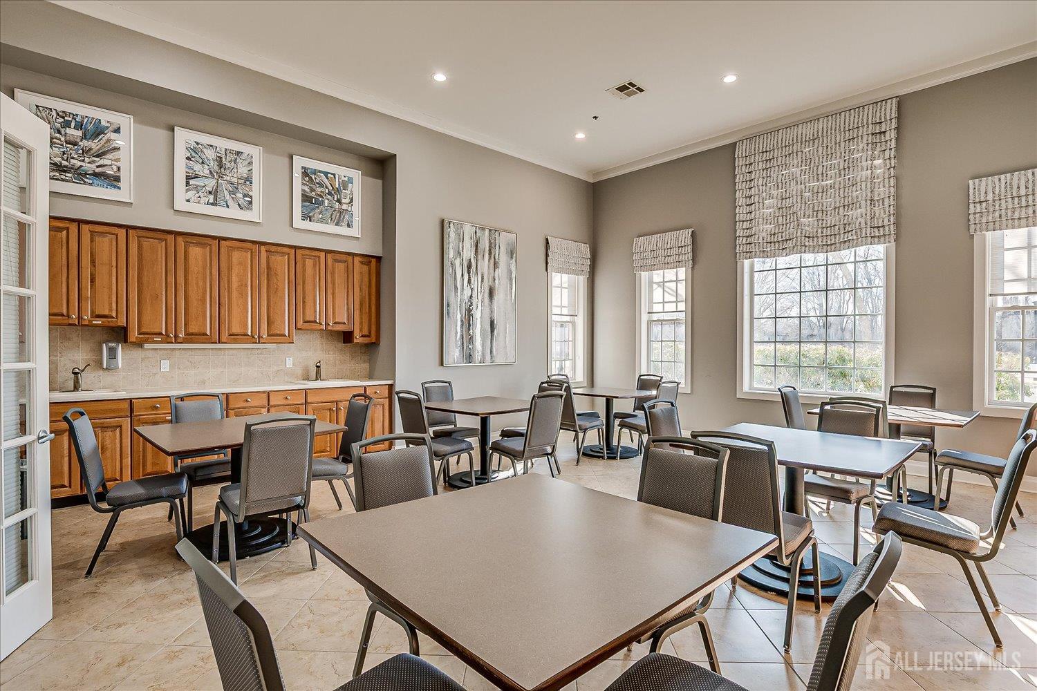 22 Silver Charm Road Manalapan, NJ 07726 - Photo 46 of 51 a view of a a dining room with furniture window and outside view