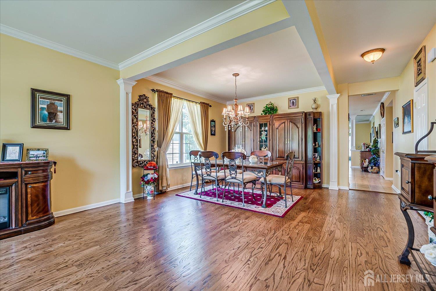 22 Silver Charm Road Manalapan, NJ 07726 - Photo 7 of 51 a living room with furniture and a flat screen tv