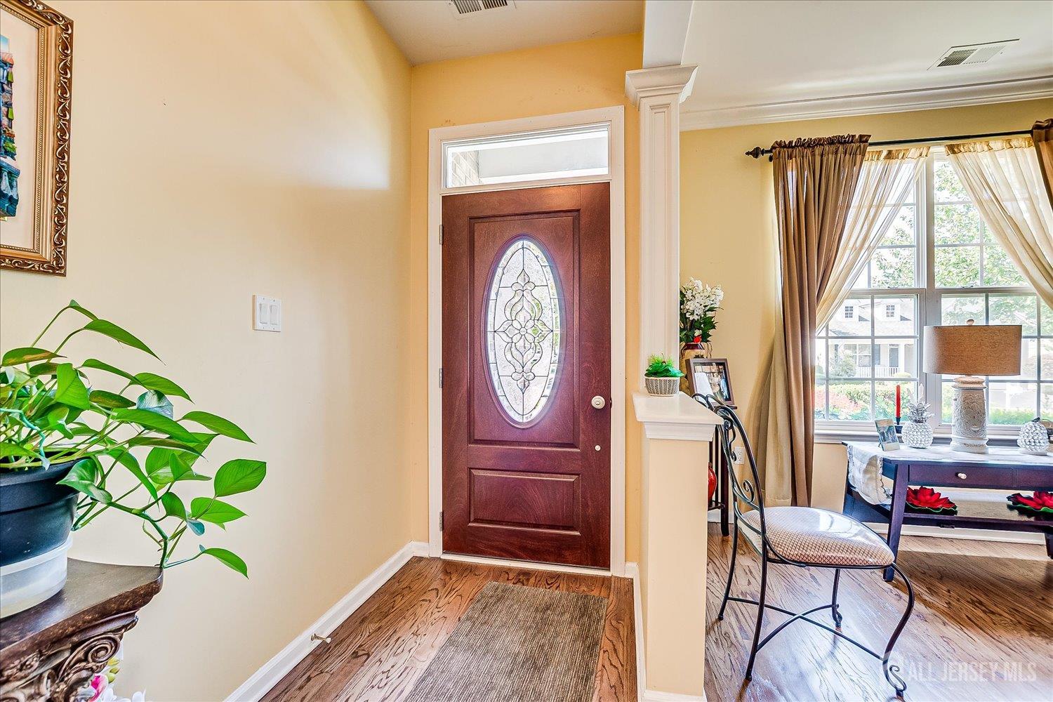 22 Silver Charm Road Manalapan, NJ 07726 - Photo 8 of 51 a living room with furniture and a window