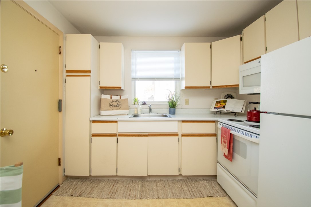 70 Carroll Avenue, Unit 510 Newport, RI 02840 - Photo 5 of 37 Pantry and cabinets efficiently placed in the kitchen.