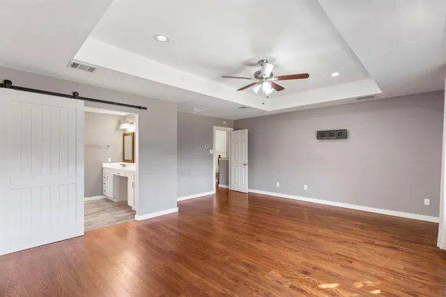a view of an empty room with glass door