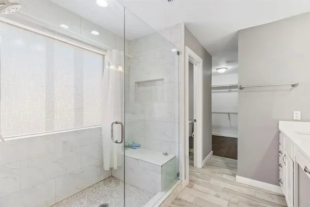 a bathroom with a bathtub and a shower