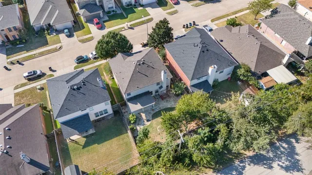 an aerial view of houses with outdoor space