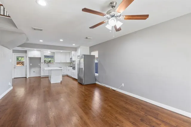 a view of kitchen with wooden floor and window