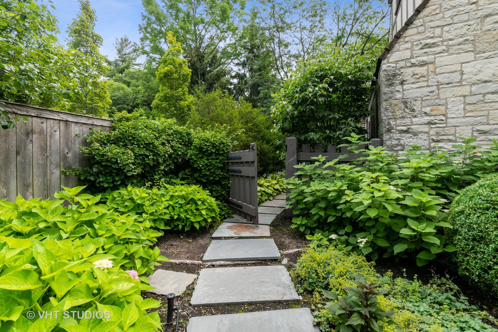 720 Ardsley Road Winnetka, IL 60093 - Photo 20 of 103 a view of path plants with tree in front of it