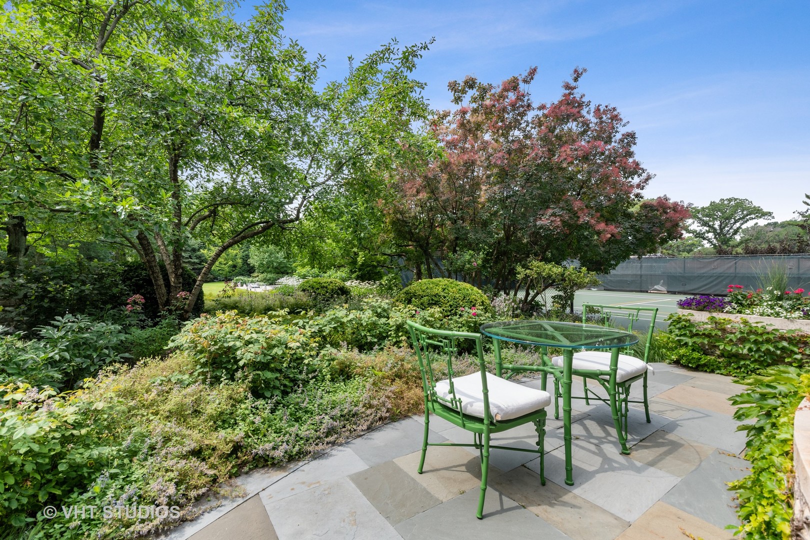 720 Ardsley Road Winnetka, IL 60093 - Photo 25 of 103 a view of a chairs and table in the garden