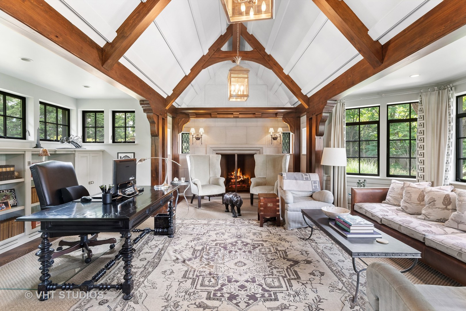 720 Ardsley Road Winnetka, IL 60093 - Photo 43 of 103 a living room with furniture a fireplace and large windows