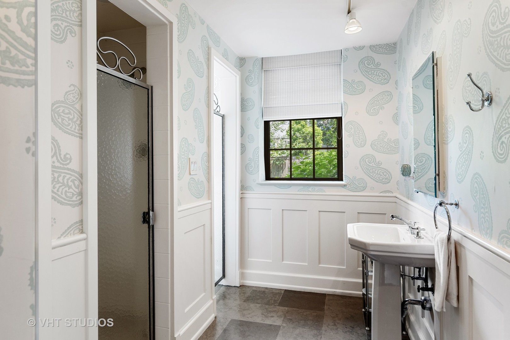 720 Ardsley Road Winnetka, IL 60093 - Photo 52 of 103 a bathroom with a sink a mirror and a window