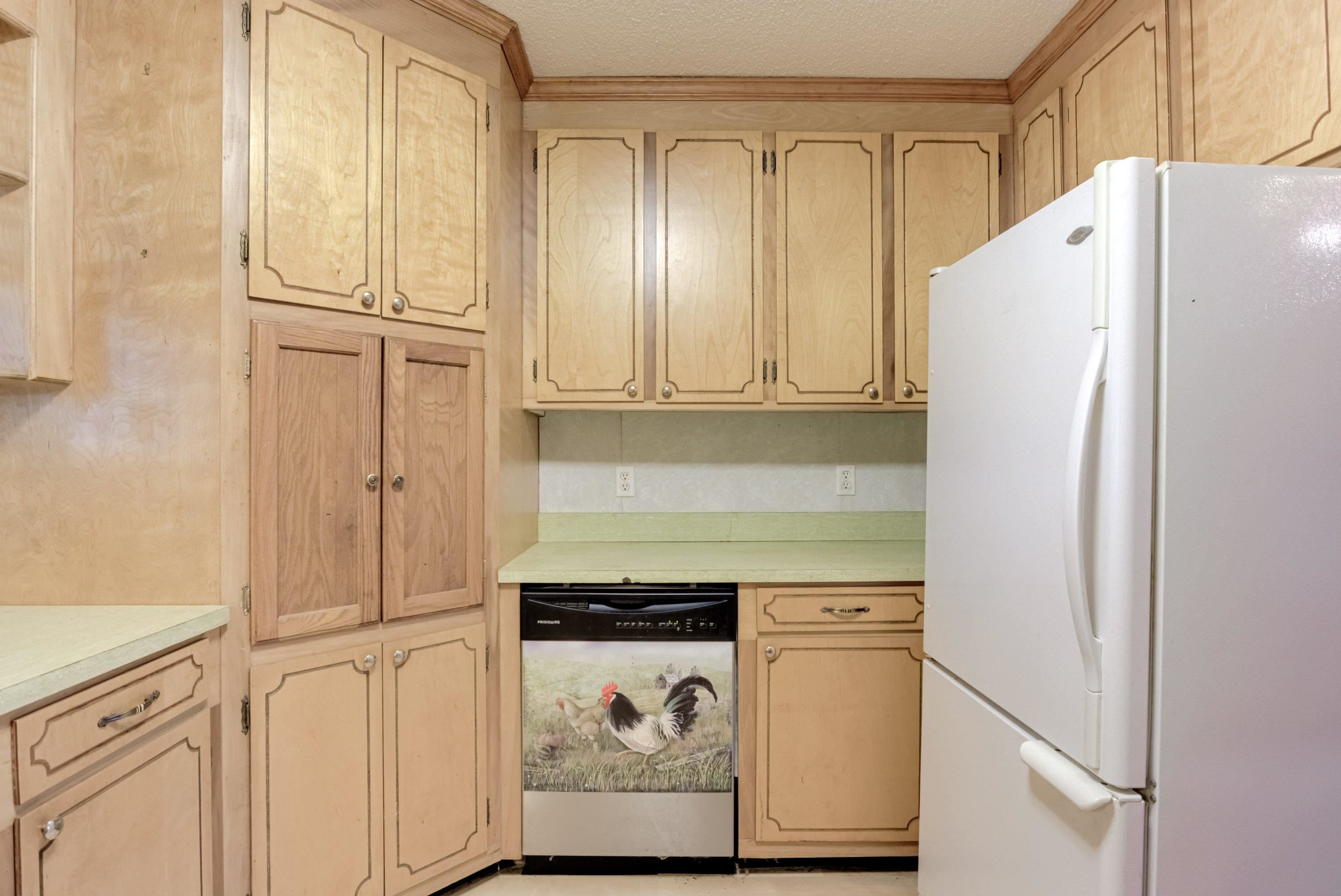 4612 Browns Pond Road Selma, NC 27576 - Photo 12 of 50 a white refrigerator freezer sitting in a kitchen