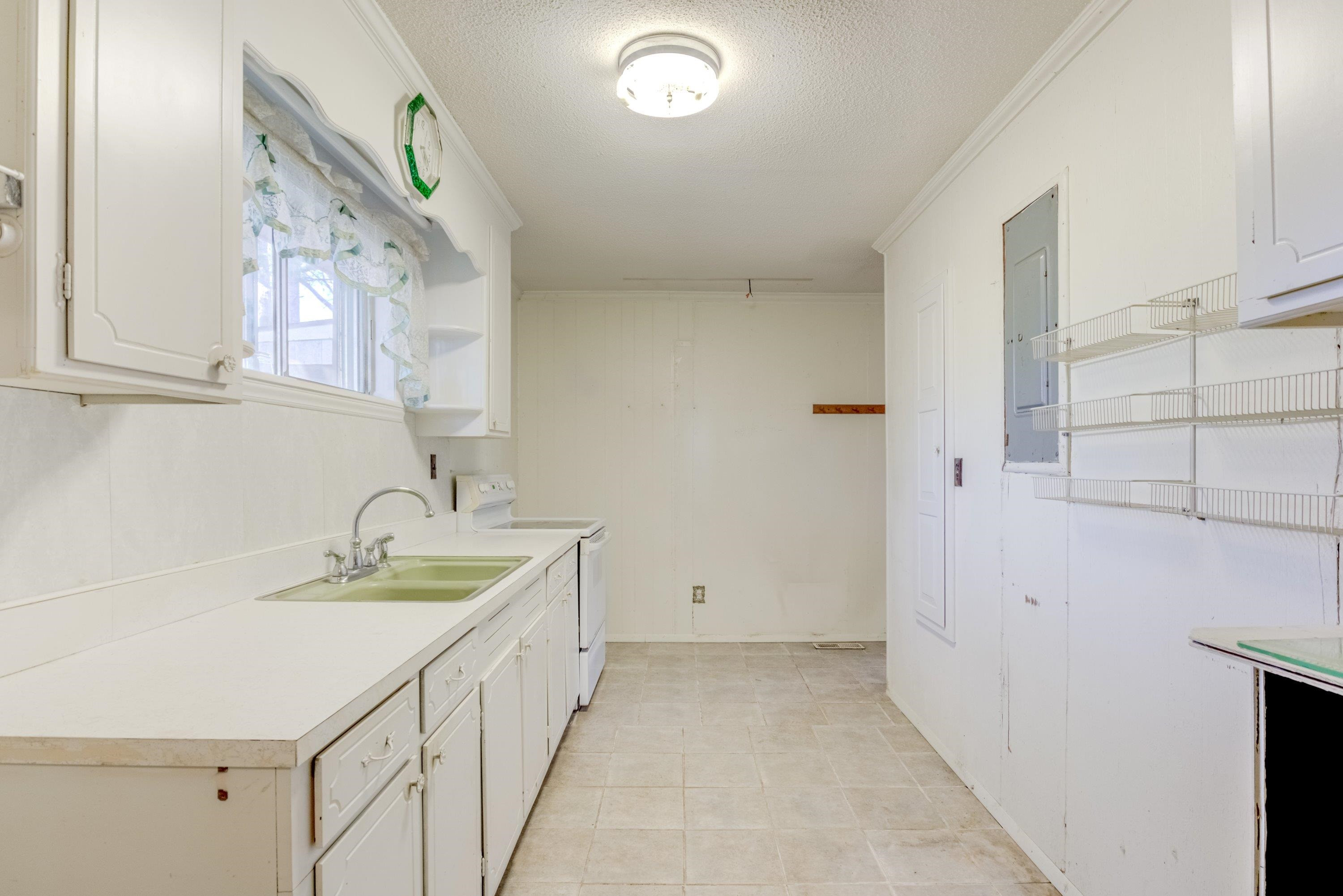 4612 Browns Pond Road Selma, NC 27576 - Photo 16 of 50 a bathroom with a double vanity sink and a mirror