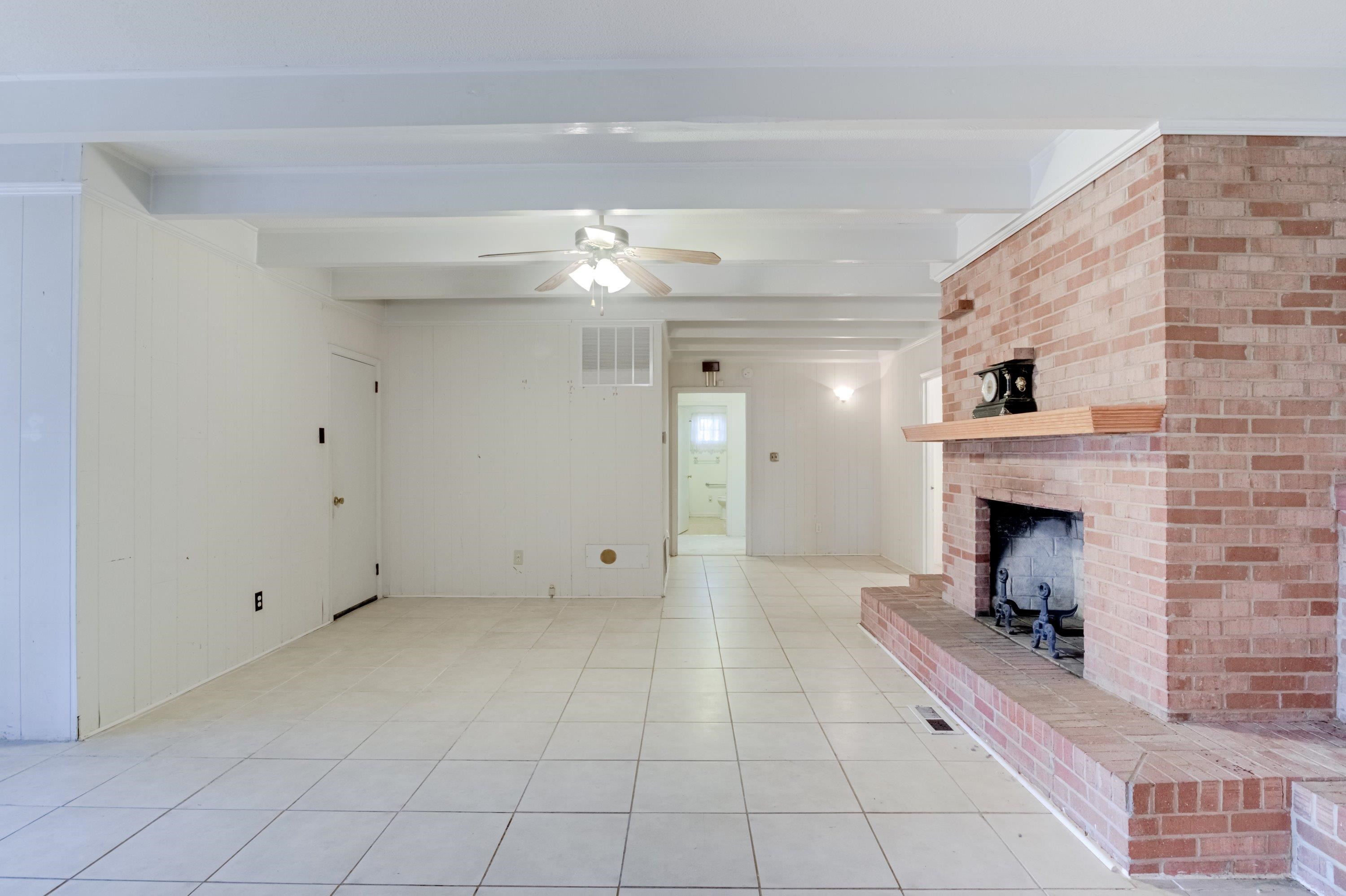 4612 Browns Pond Road Selma, NC 27576 - Photo 19 of 50 a room with fireplace and chandelier