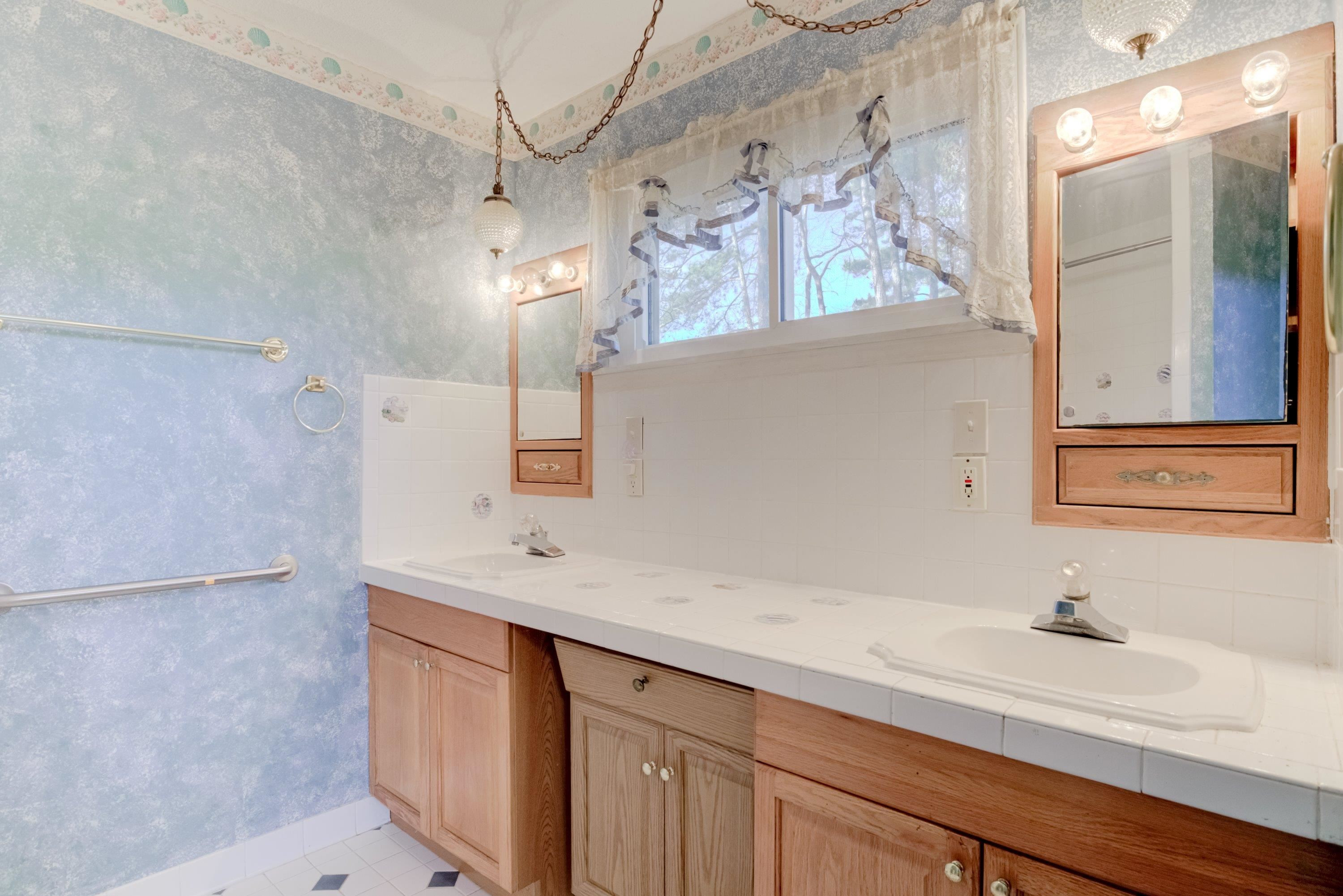 4612 Browns Pond Road Selma, NC 27576 - Photo 28 of 50 a bathroom with a sink and a mirror