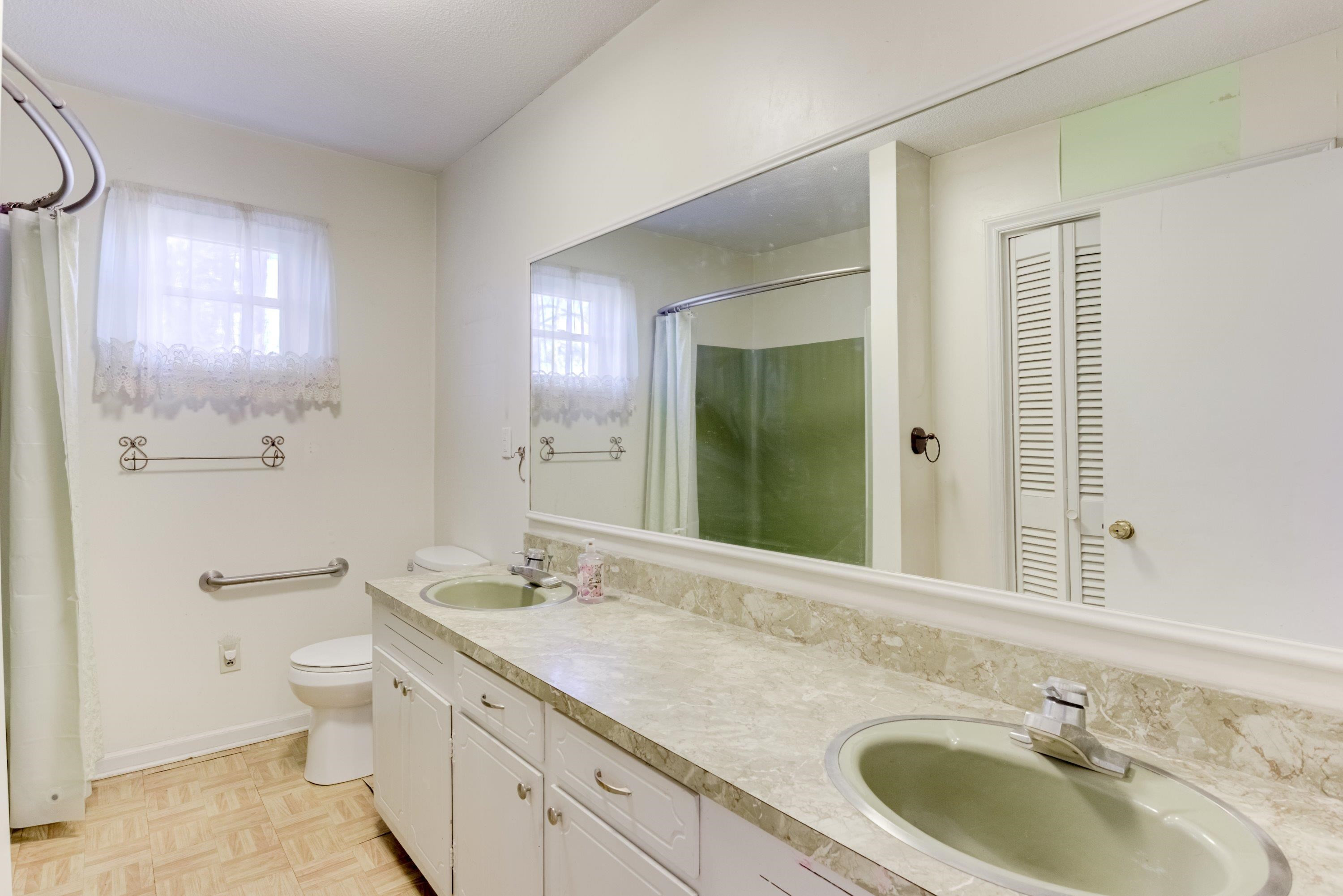 4612 Browns Pond Road Selma, NC 27576 - Photo 30 of 50 a bathroom with a granite countertop sink toilet and shower
