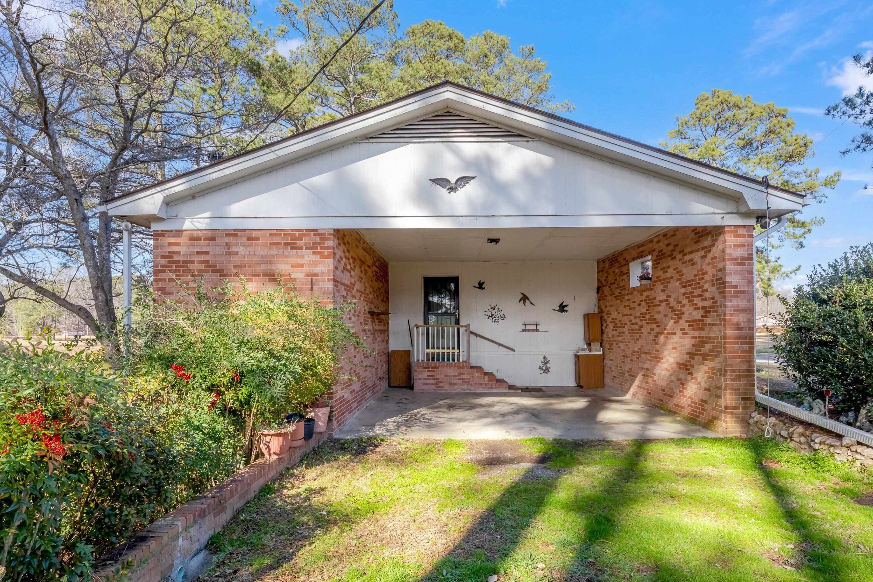 4612 Browns Pond Road Selma, NC 27576 - Photo 41 of 50 a view of a house with a small yard