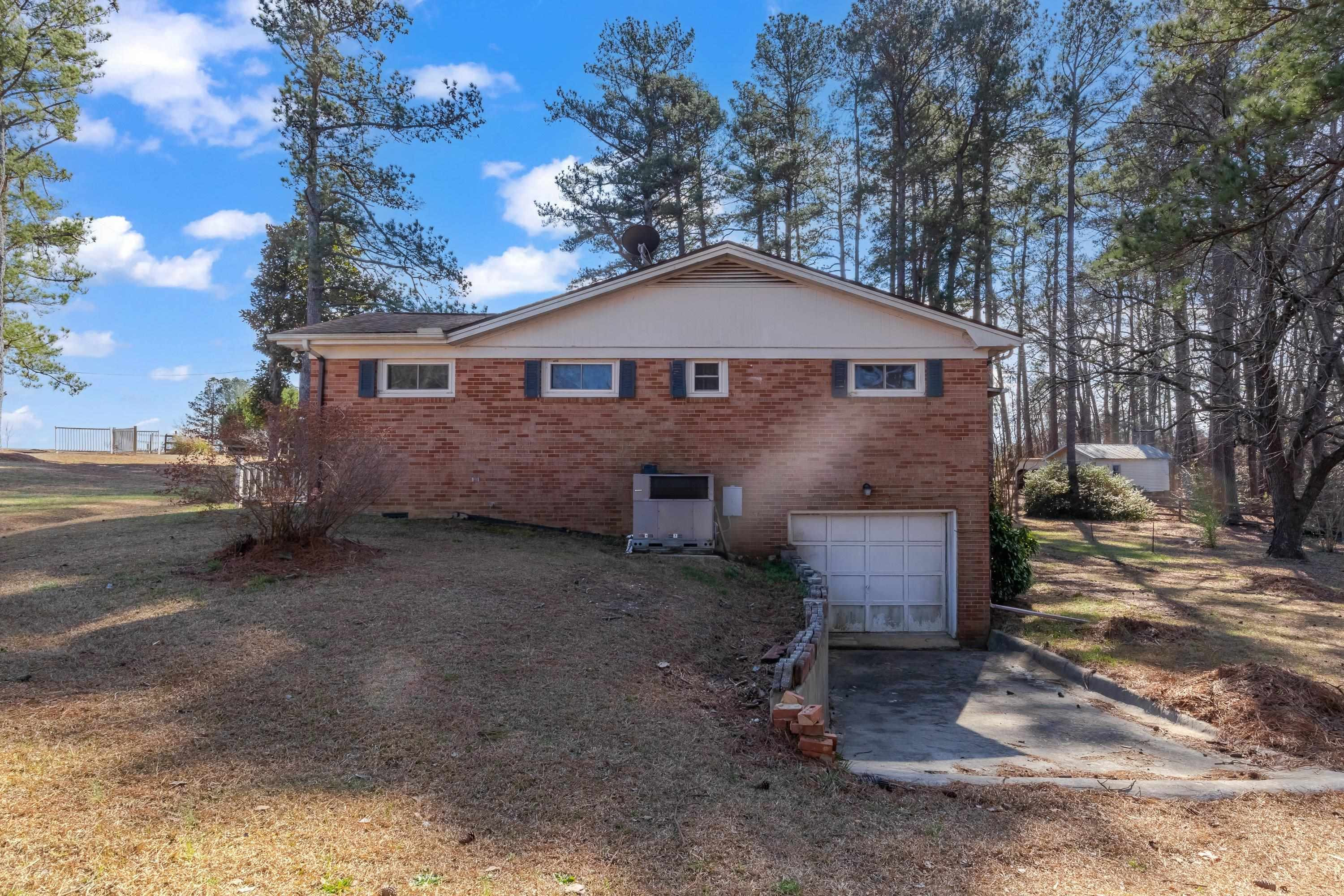 4612 Browns Pond Road Selma, NC 27576 - Photo 42 of 50 a front view of a house with a yard and garage