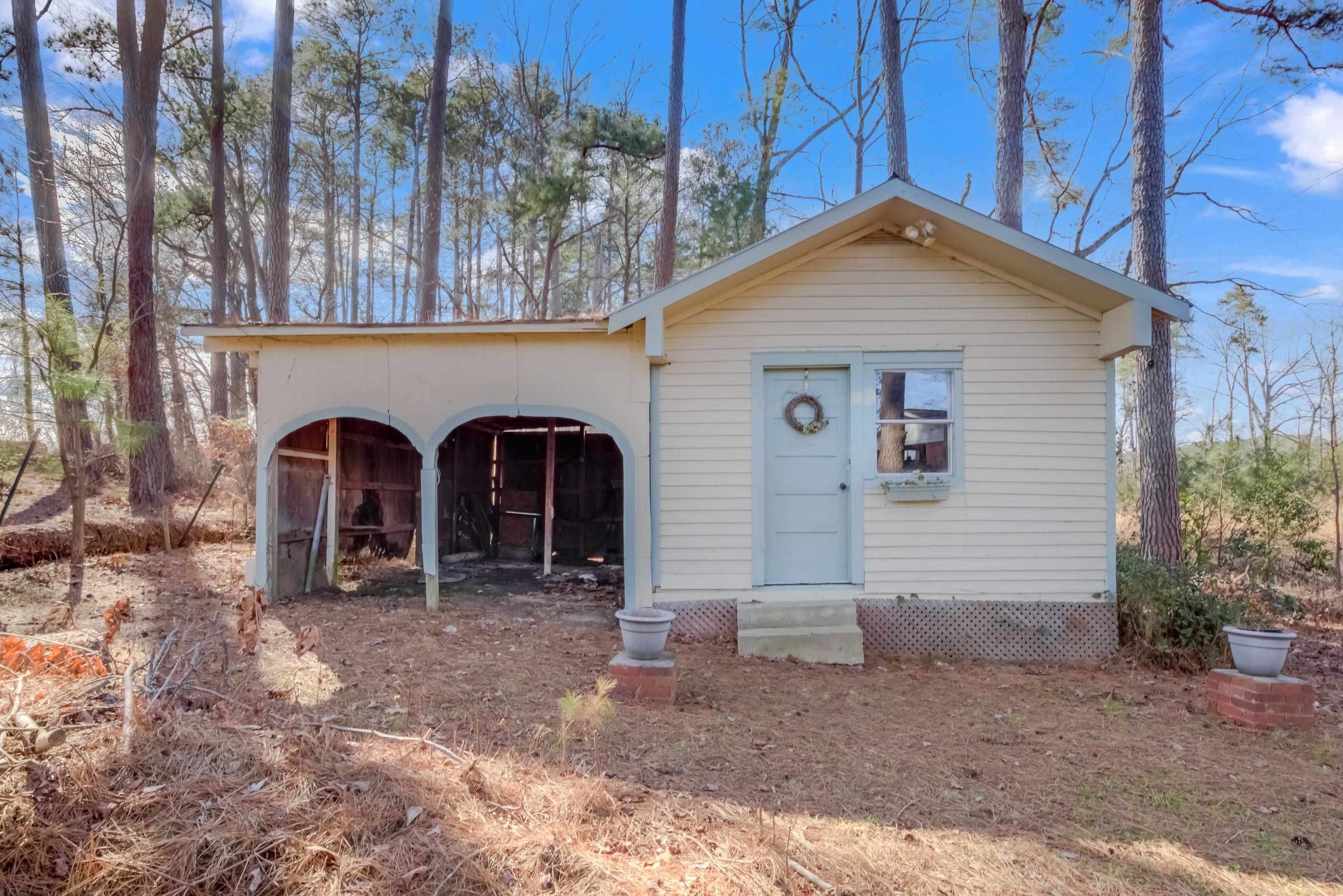 4612 Browns Pond Road Selma, NC 27576 - Photo 50 of 50 a view of a grey house with large trees