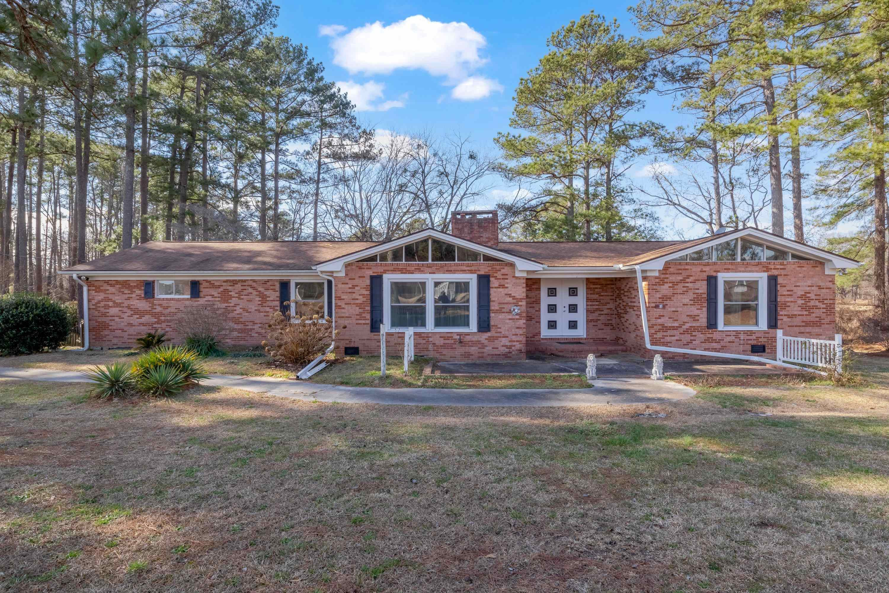 4612 Browns Pond Road Selma, NC 27576 - Photo 5 of 50 a front view of a house with a yard