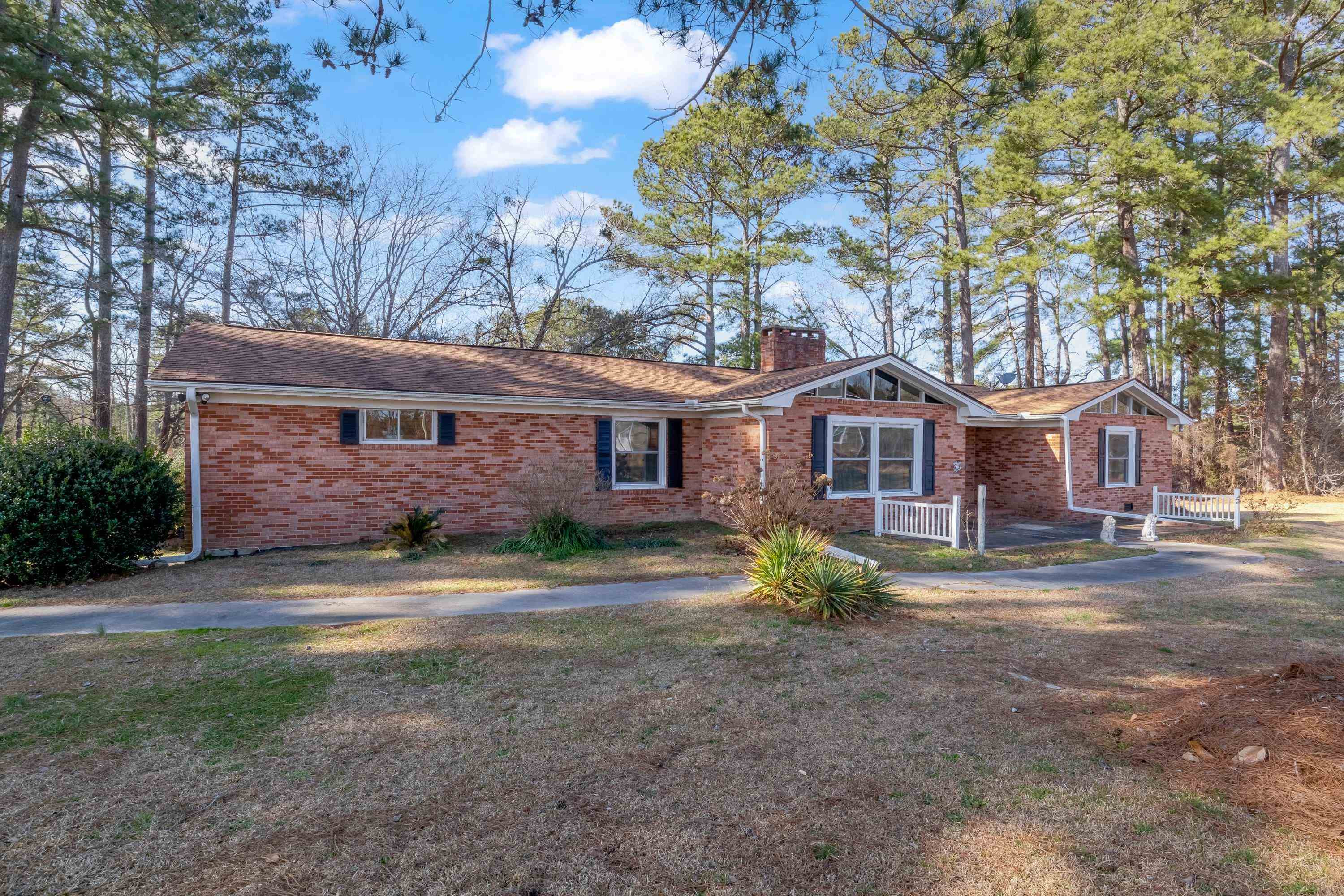 4612 Browns Pond Road Selma, NC 27576 - Photo 6 of 50 a front view of a house with a yard and garage