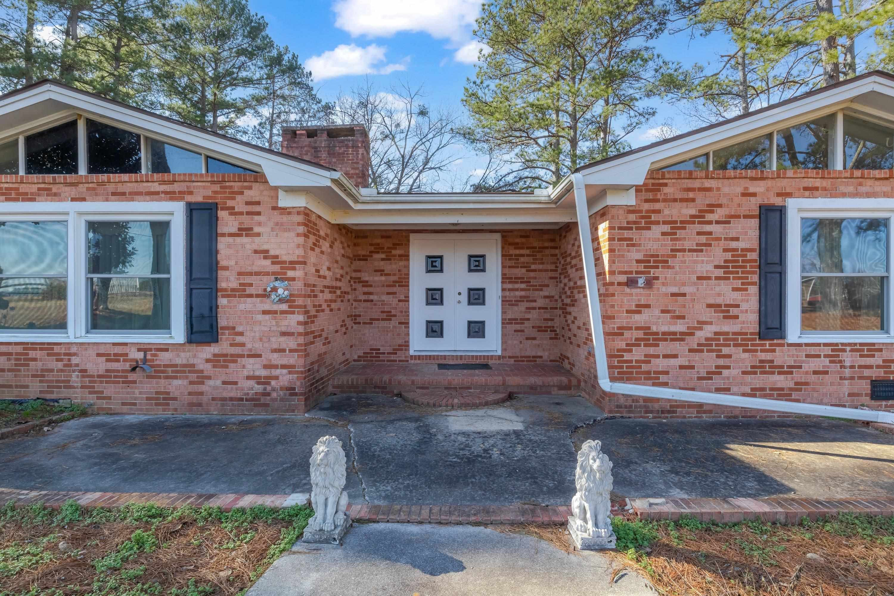 4612 Browns Pond Road Selma, NC 27576 - Photo 7 of 50 a front view of a house with garden