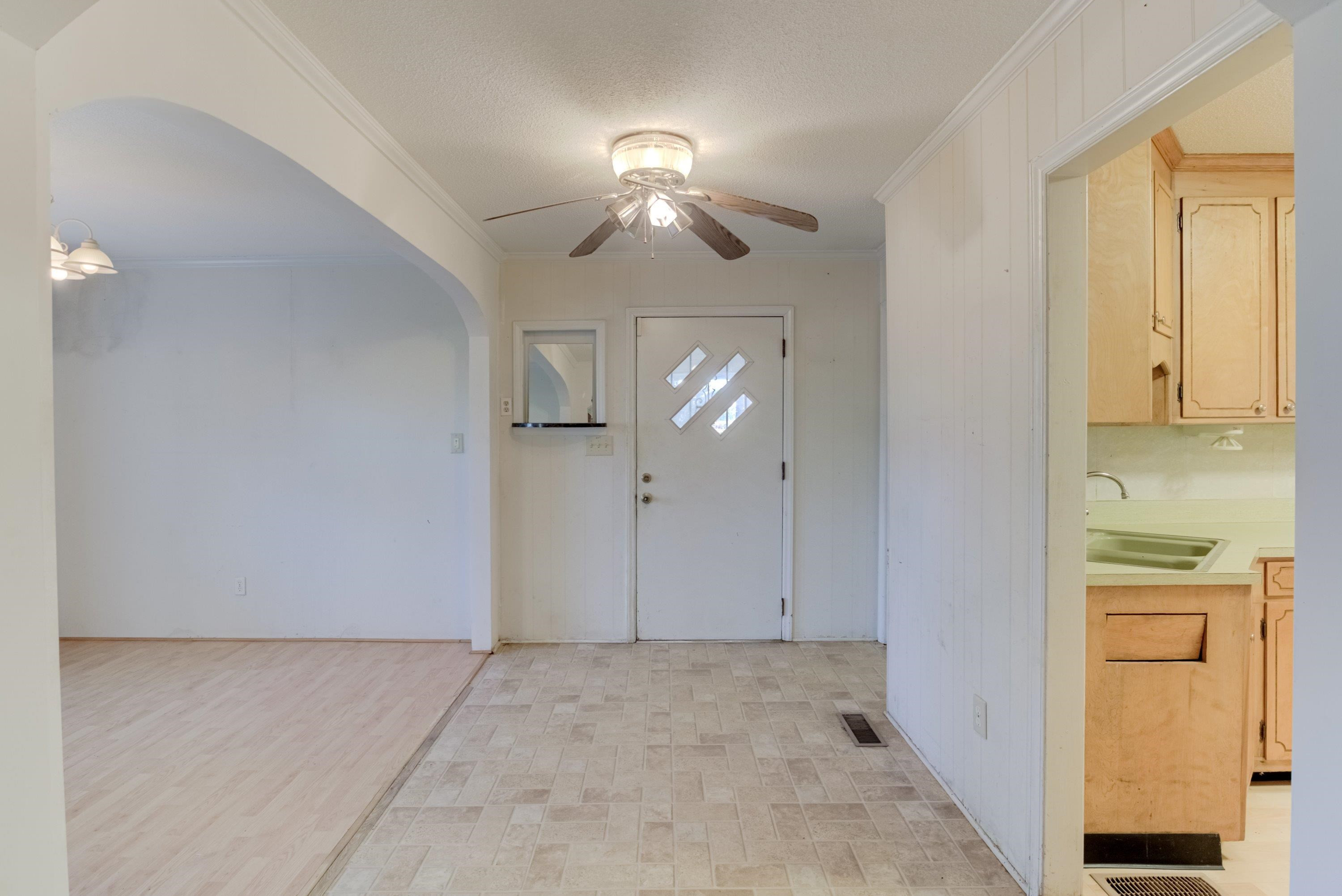 4612 Browns Pond Road Selma, NC 27576 - Photo 9 of 50 a view of a livingroom with a chandelier fan and kitchen view