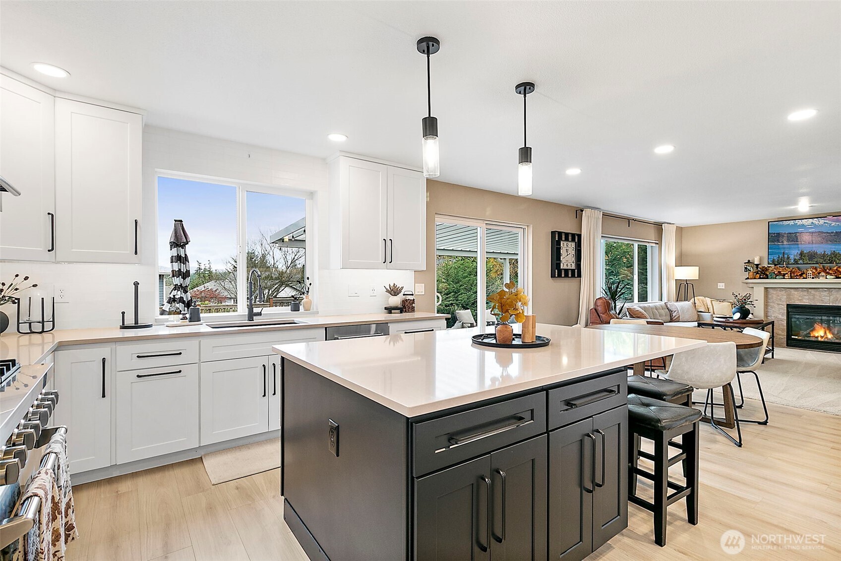 20024 Southeast 260th Place Covington, WA 98042 - Photo 15 of 40 a kitchen with a sink stove and cabinets