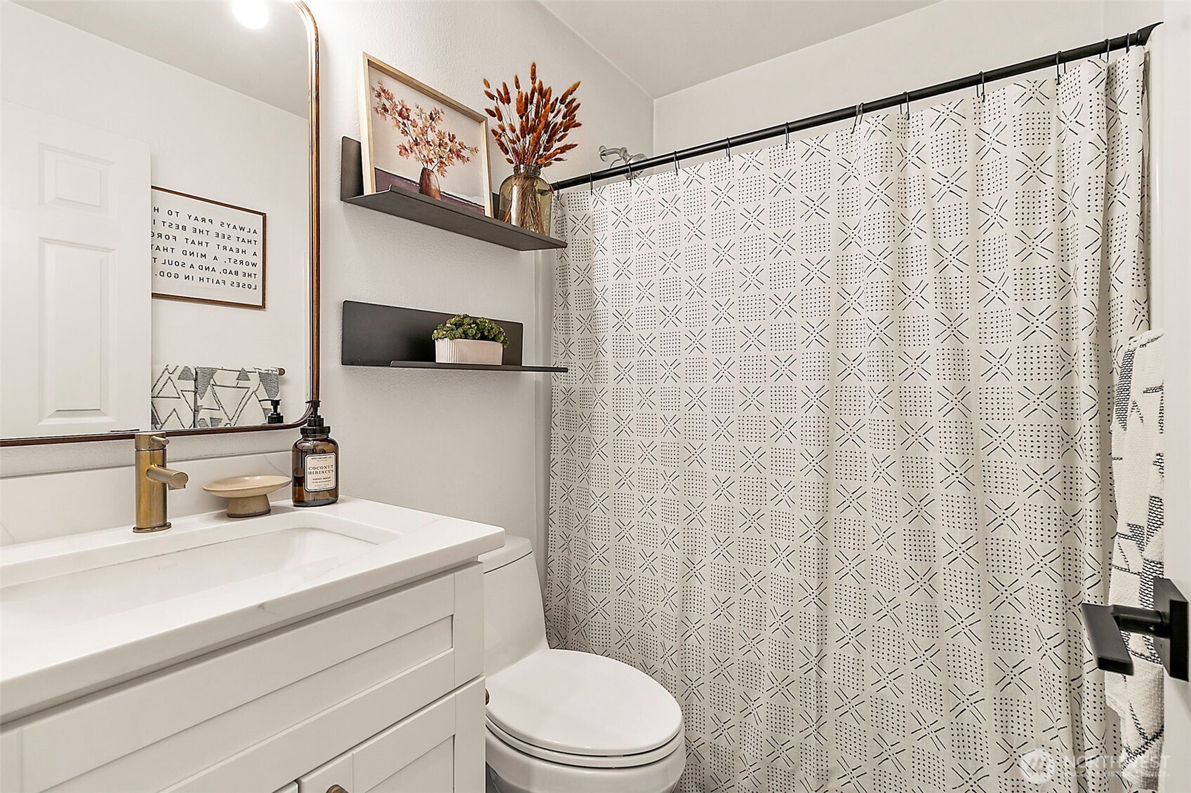 20024 Southeast 260th Place Covington, WA 98042 - Photo 23 of 40 a bathroom with a sink a toilet and a mirror