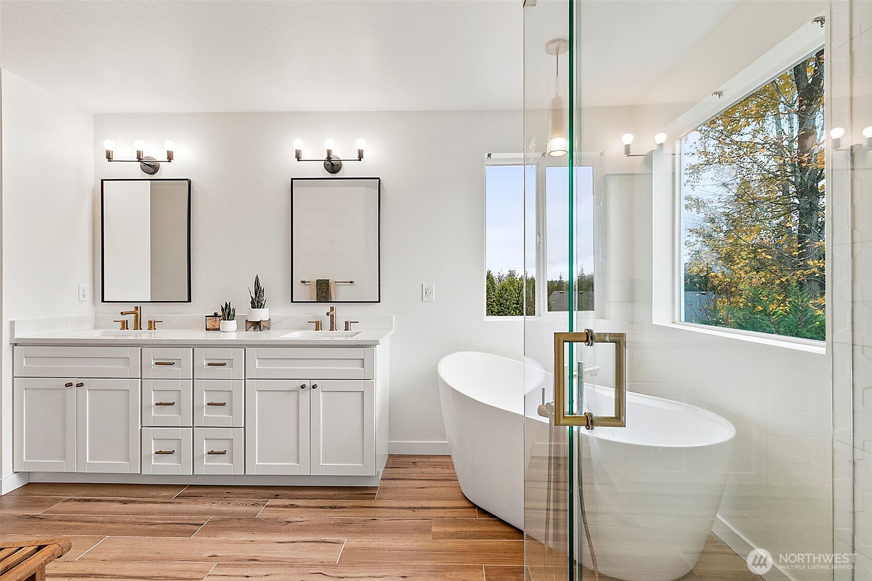 20024 Southeast 260th Place Covington, WA 98042 - Photo 27 of 40 a spacious bathroom with double vanity and a bathtub