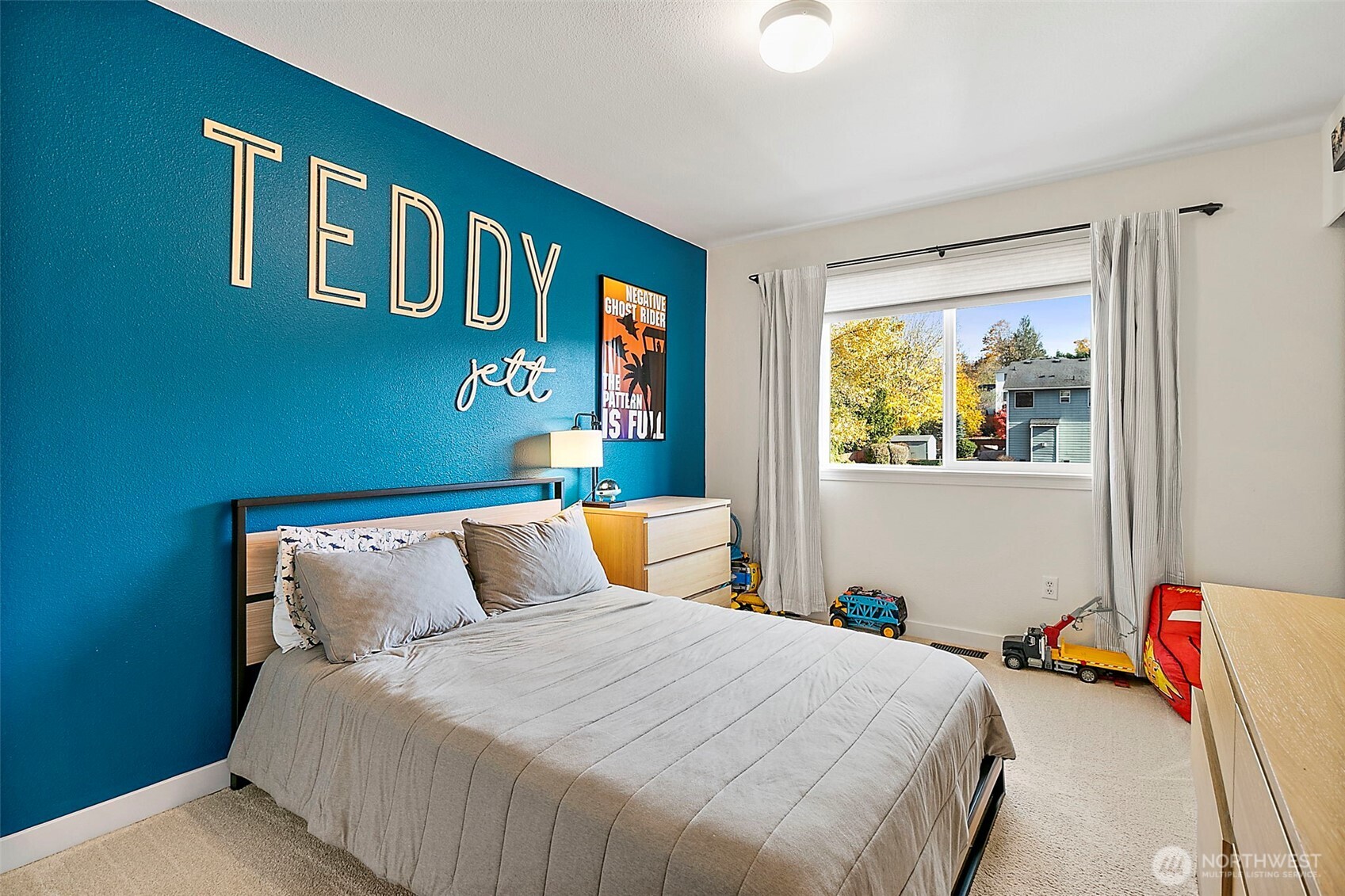 20024 Southeast 260th Place Covington, WA 98042 - Photo 30 of 40 a bedroom with a bed and painting on the wall