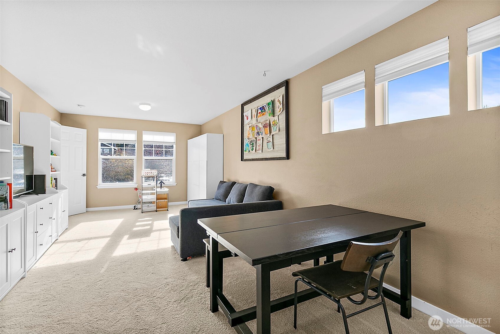 20024 Southeast 260th Place Covington, WA 98042 - Photo 34 of 40 a view of a dining room with furniture and a large window
