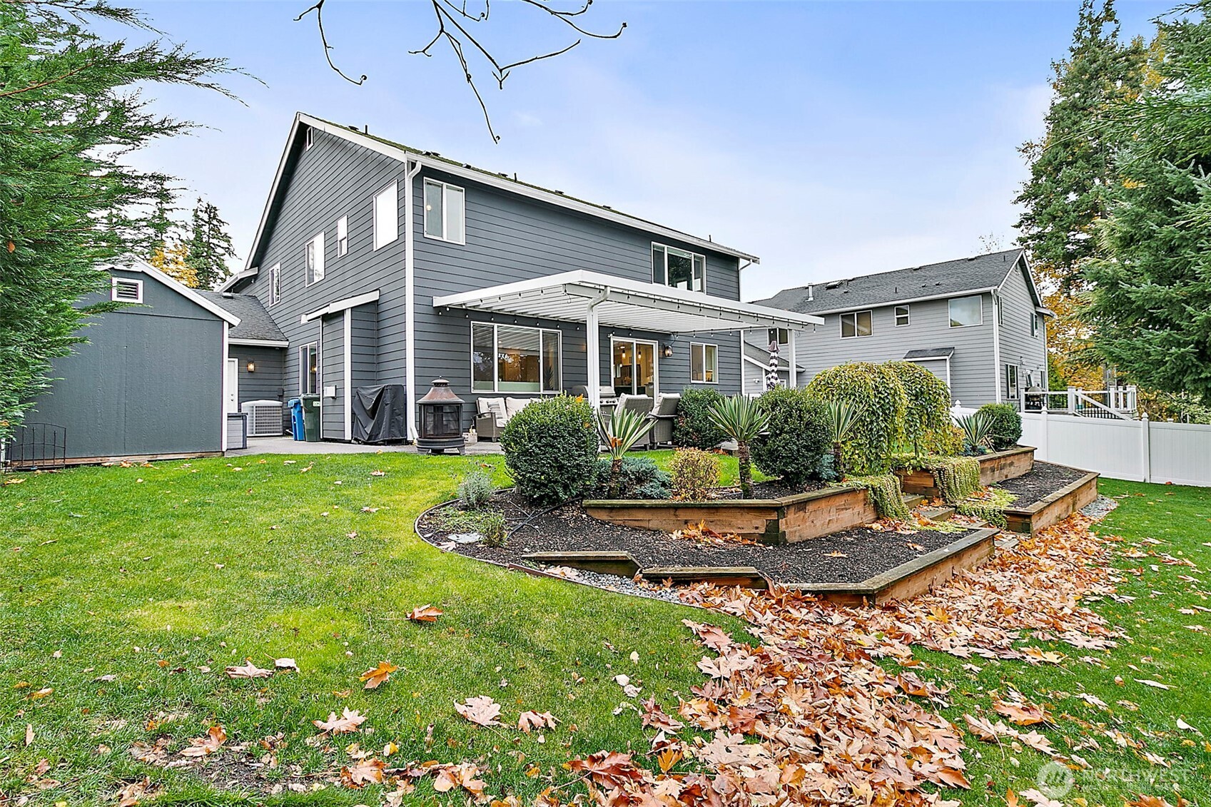 20024 Southeast 260th Place Covington, WA 98042 - Photo 39 of 40 a front view of a house with a yard